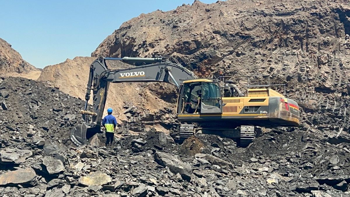 Tracked excavator working an open-cast pit